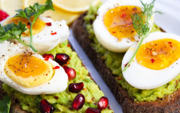 Avocado Toasts with Eggs, Herbs, and Pomegranate Seeds