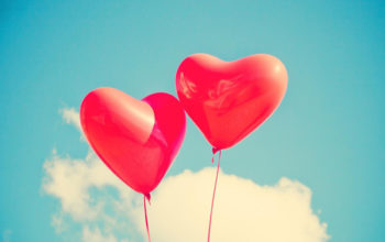 Two Red Heart-Shaped Balloons