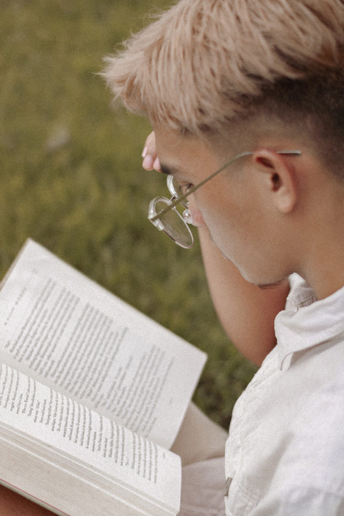 Person Reading a Book Outside
