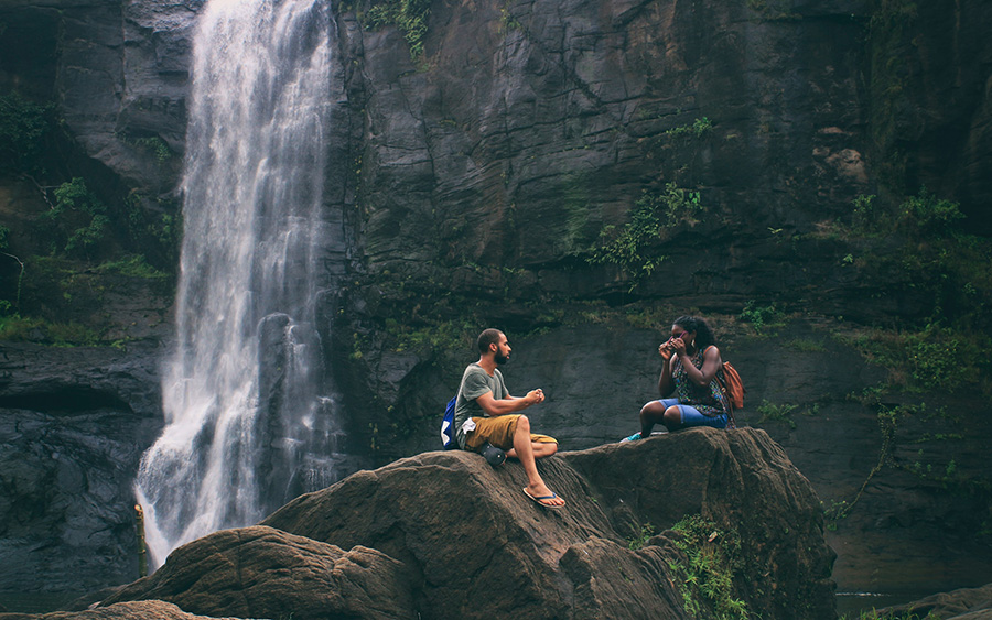 Traveler Sitting on a Rock