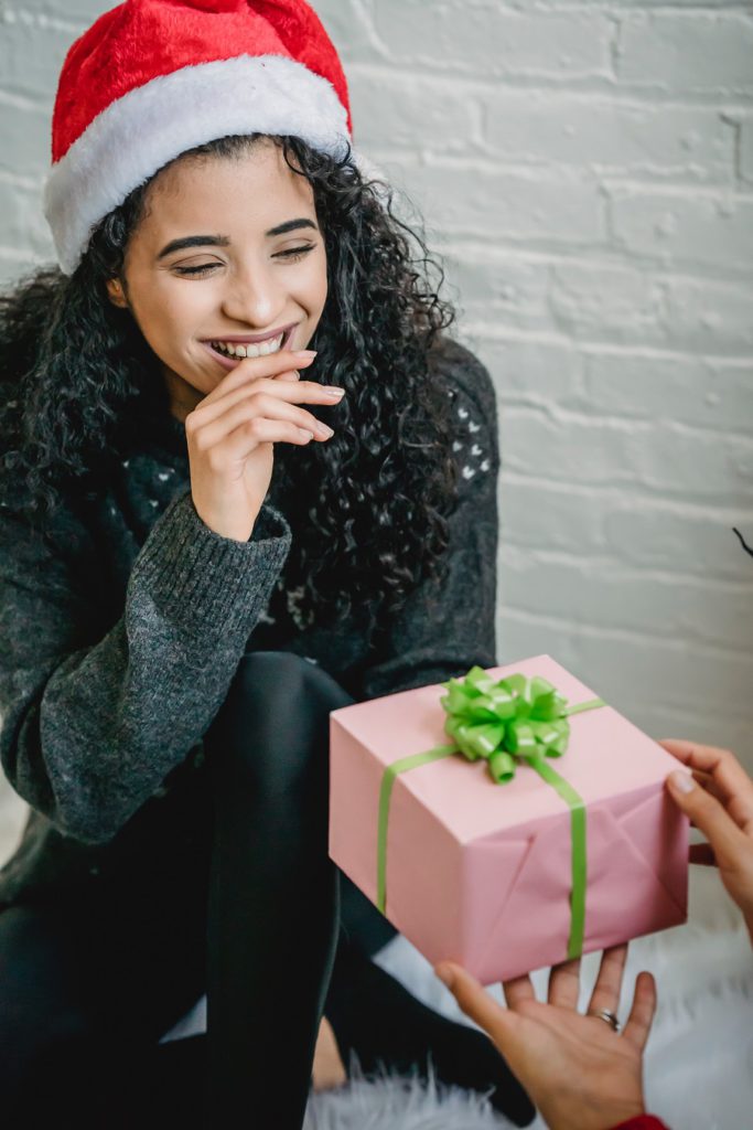 Giving of Christmas present Giving of Christmas present