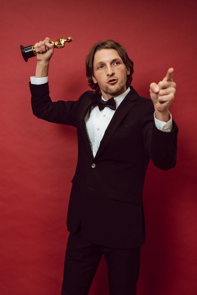 Man holding a trophy Man holding a trophy